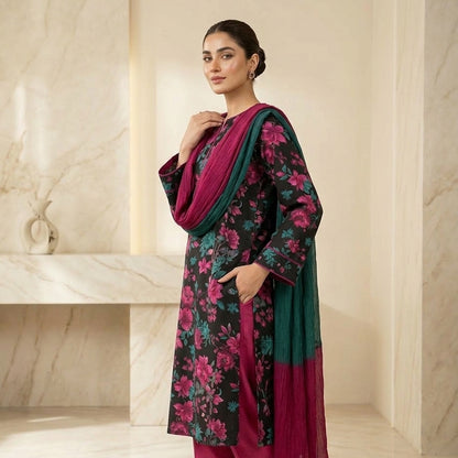 Woman wearing a floral dress with a green dupatta in a marble interior setting