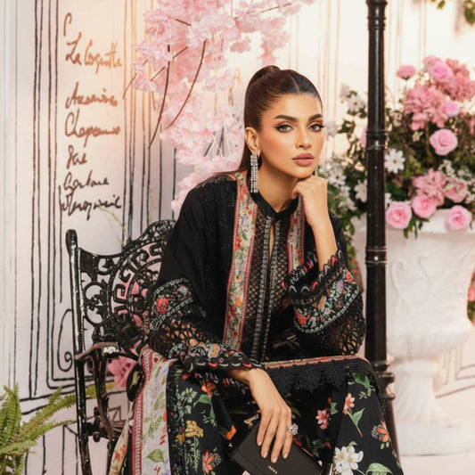 Woman in a floral outfit sitting on a decorative chair with cherry blossoms in the background