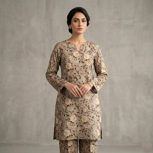 Woman wearing a floral kurta with a plain background