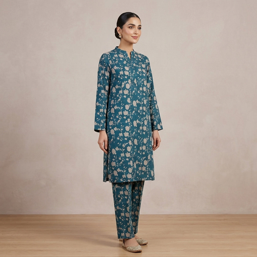 Woman wearing a blue floral outfit on a beige background