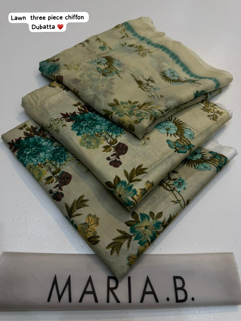 Three folded pieces of floral chiffon fabric with 'Maria B.' branding on a white background.