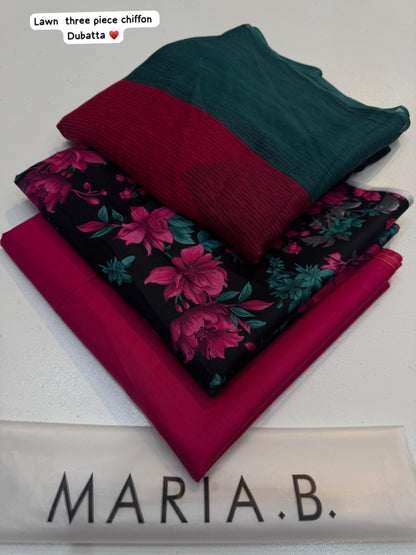 Stack of fabric pieces in green, red, and floral pattern with 'Maria B.' branding.