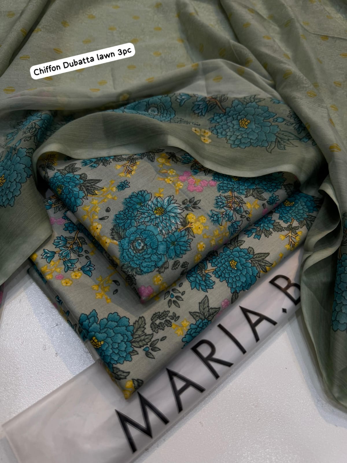 Folded fabric with floral pattern on a light background