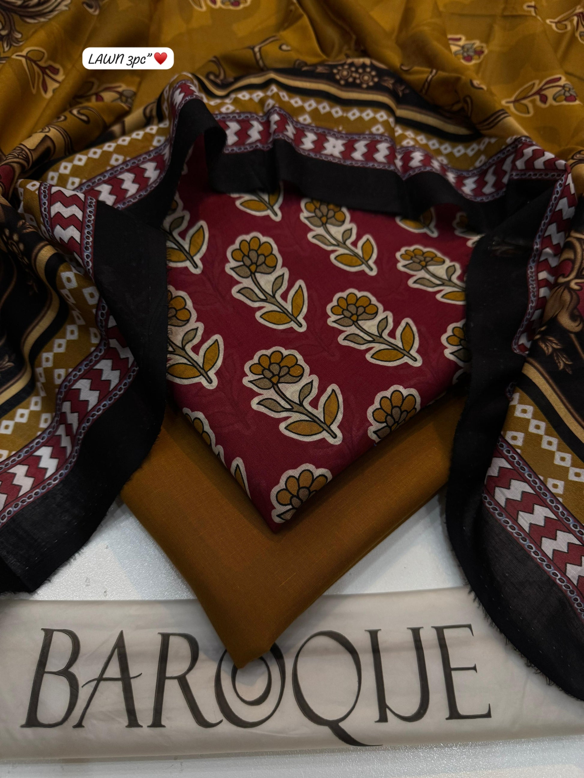Textile with floral pattern and 'BAROQUE' branding on a white background